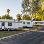 Various RV caravans camping on campsites at the caravan holiday park.