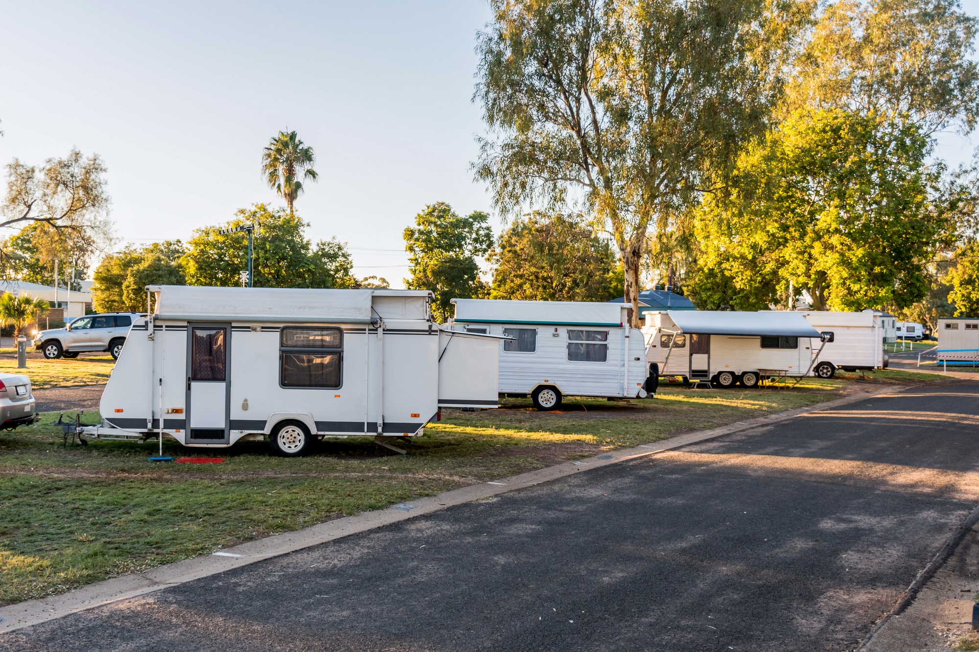 Various RV caravans camping on campsites at the caravan holiday park.